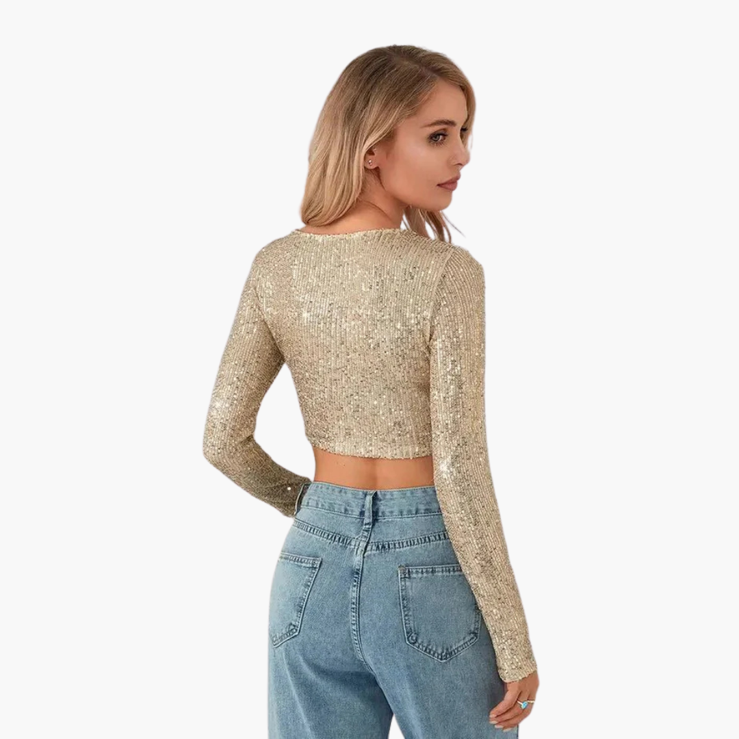 Long sleeve women's top with round neckline and sequin exterior