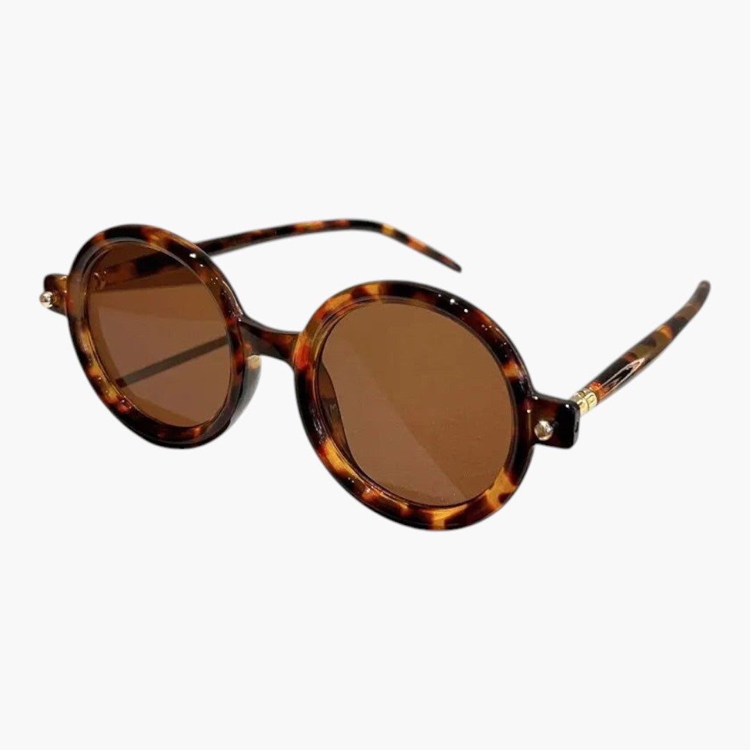 Occhiali da sole donna con montatura rotonda e aste larghe