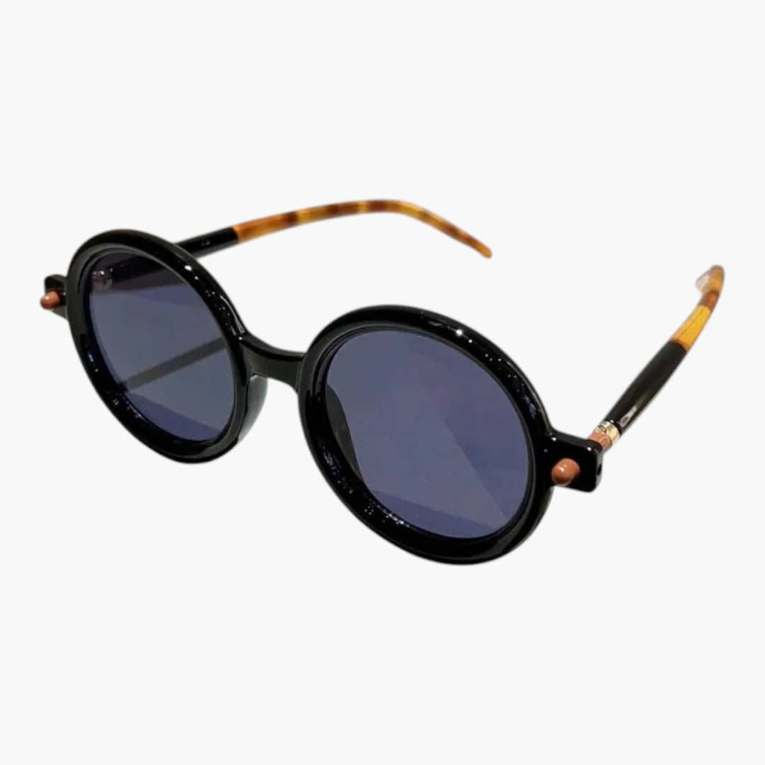 Occhiali da sole donna con montatura rotonda e aste larghe
