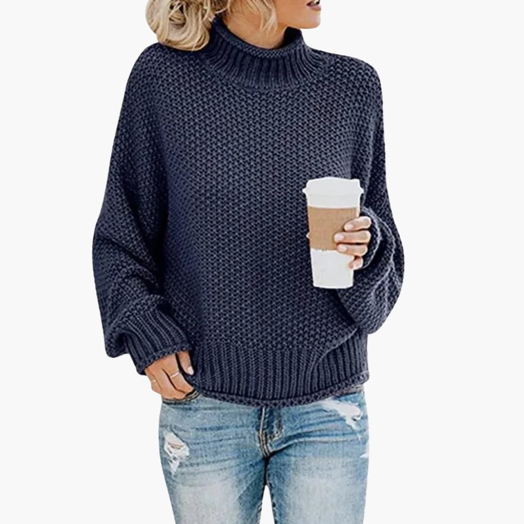 Pull femme à col montant et bords côtelés