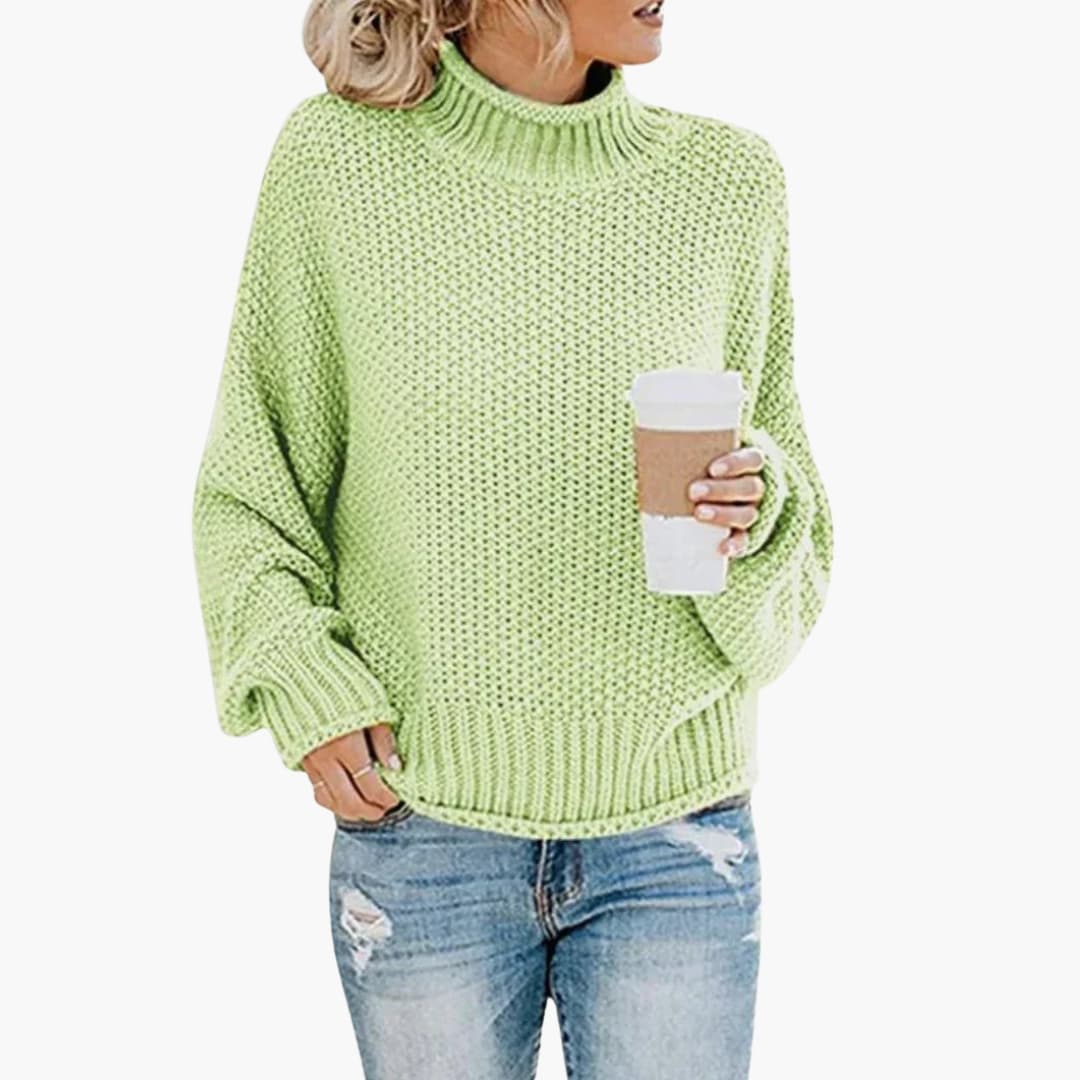 Pull femme à col montant et bords côtelés