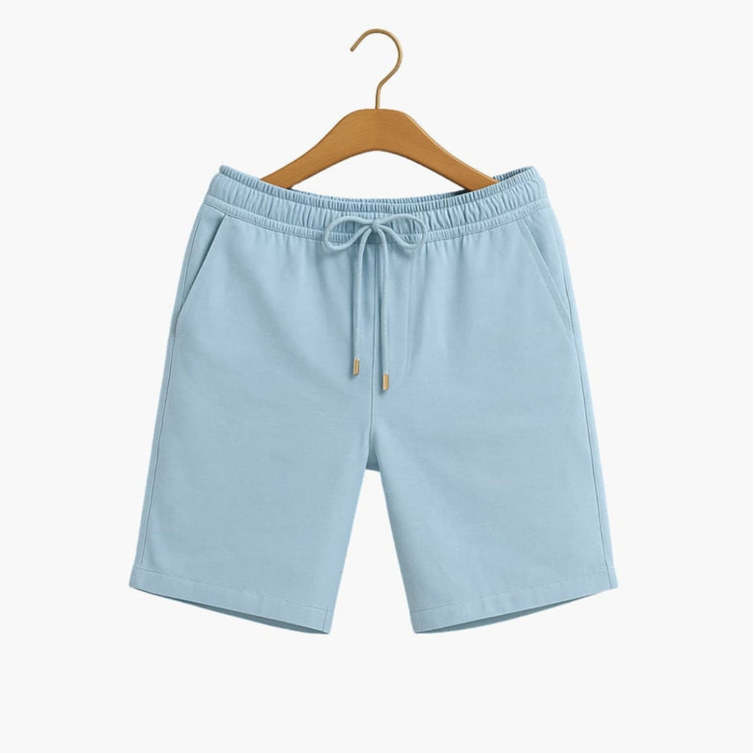 Short homme a taille à poches latérales et surface unie