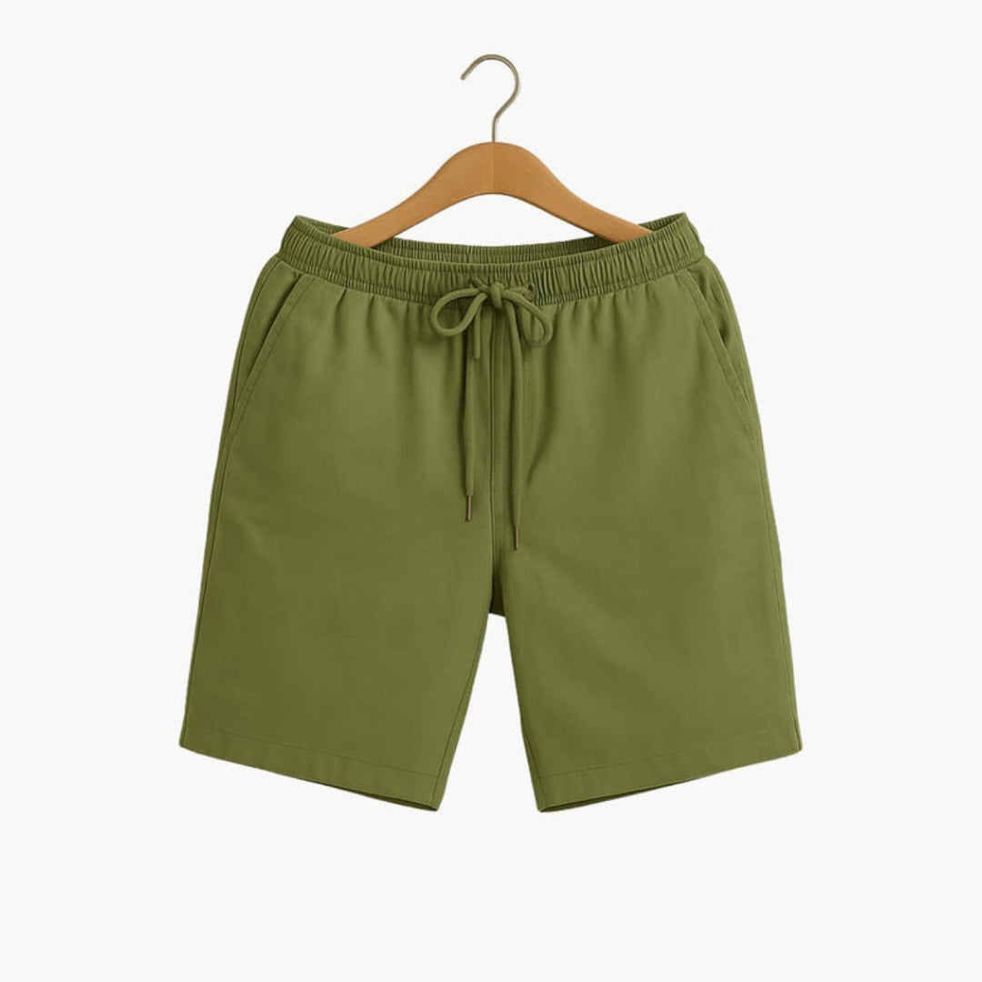 Short homme a taille à poches latérales et surface unie