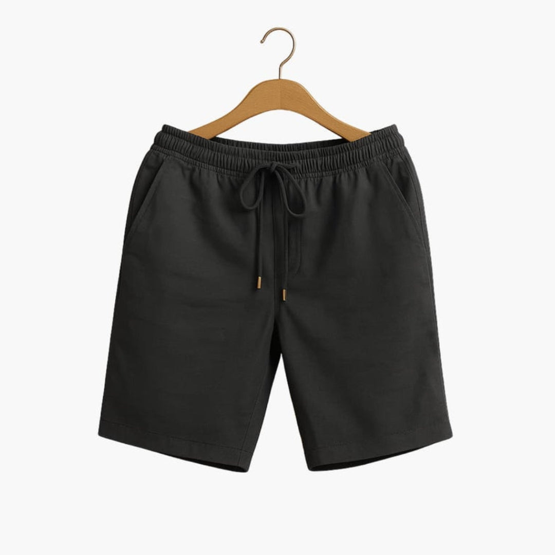 Short homme a taille à poches latérales et surface unie