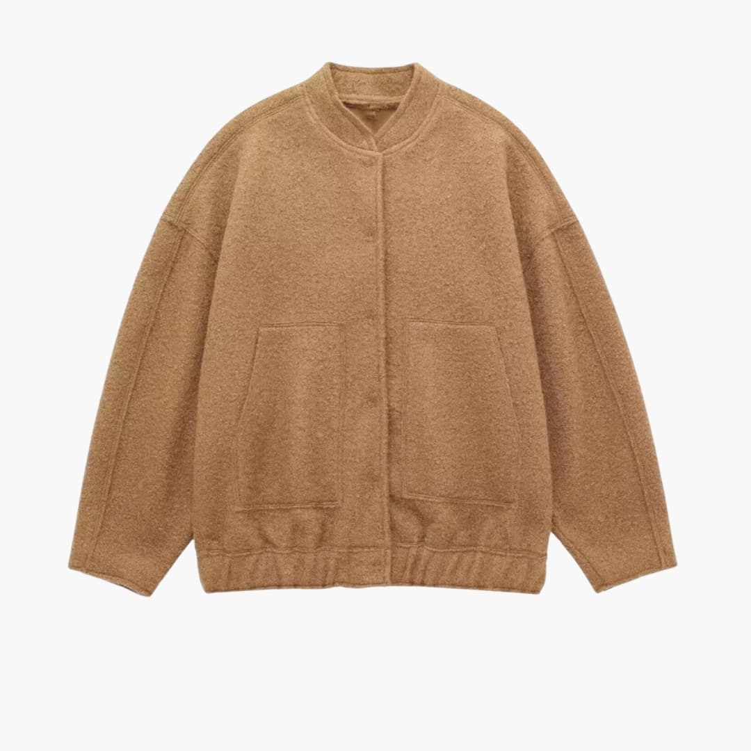 Dame bomber oversize med forlommer og skjult lukning