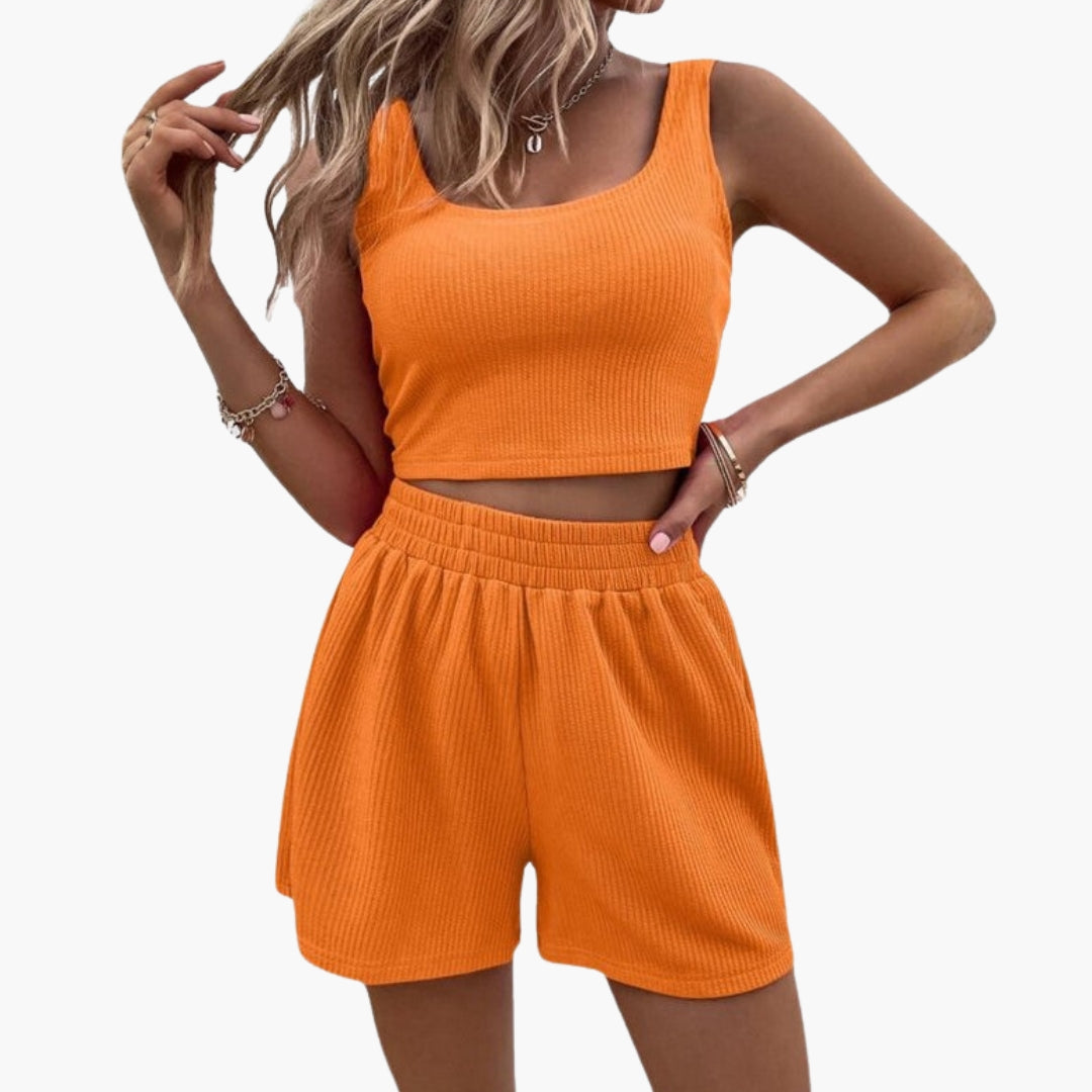 Sæt med korte sportsshorts til kvinder med kort top og elastisk talje