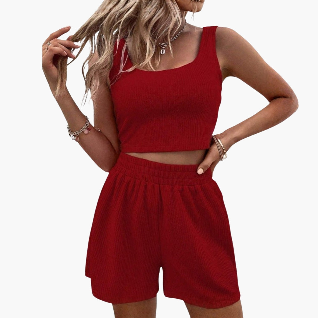Sæt med korte sportsshorts til kvinder med kort top og elastisk talje