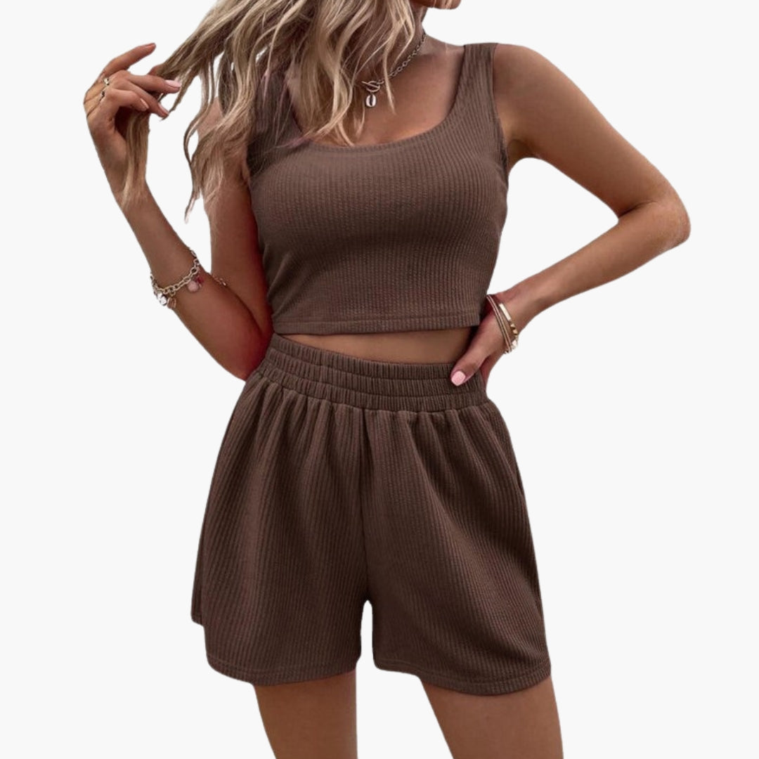 Sæt med korte sportsshorts til kvinder med kort top og elastisk talje