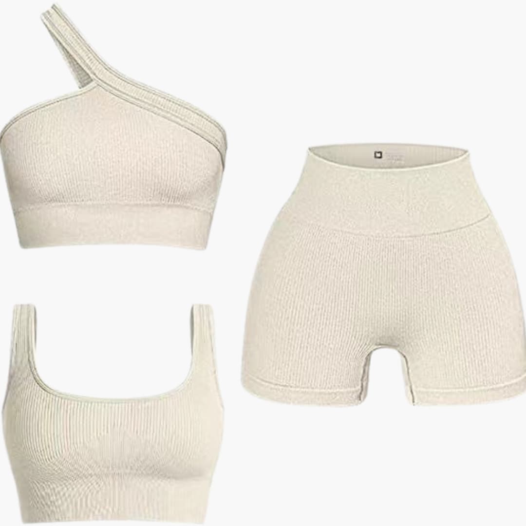 To-delt sæt til kvinder med asymmetrisk top og højtaljede shorts