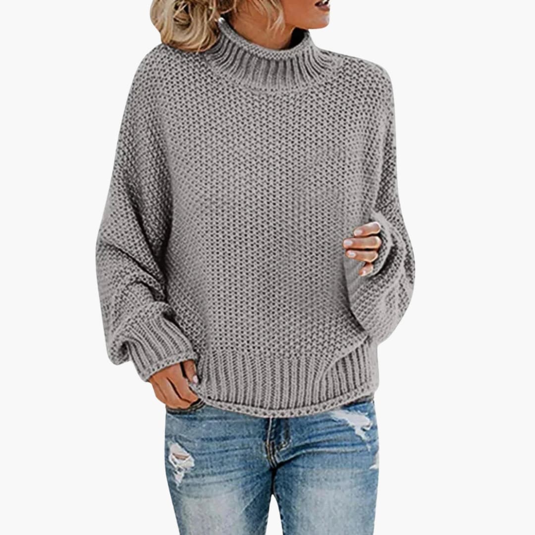 Pull femme à col montant et bords côtelés
