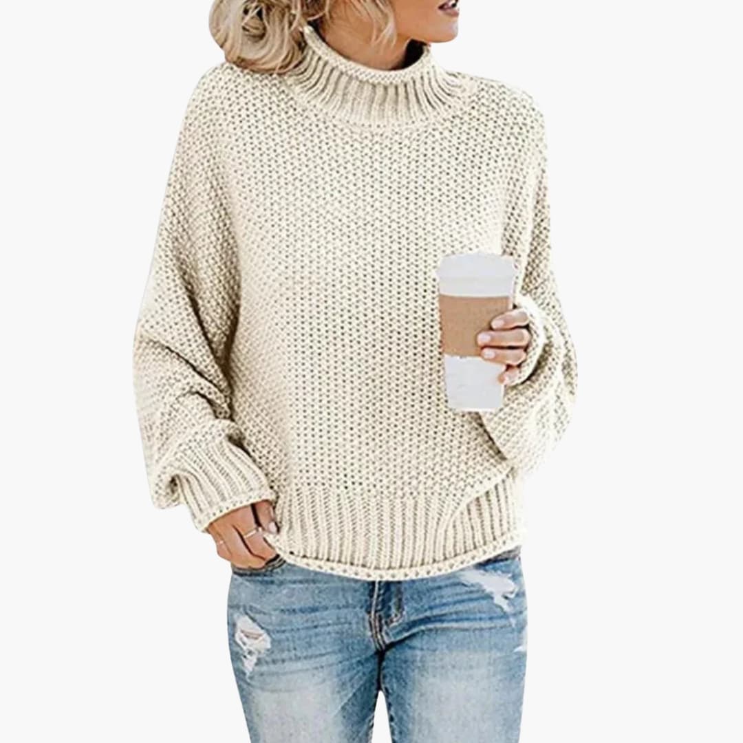 Pull femme à col montant et bords côtelés