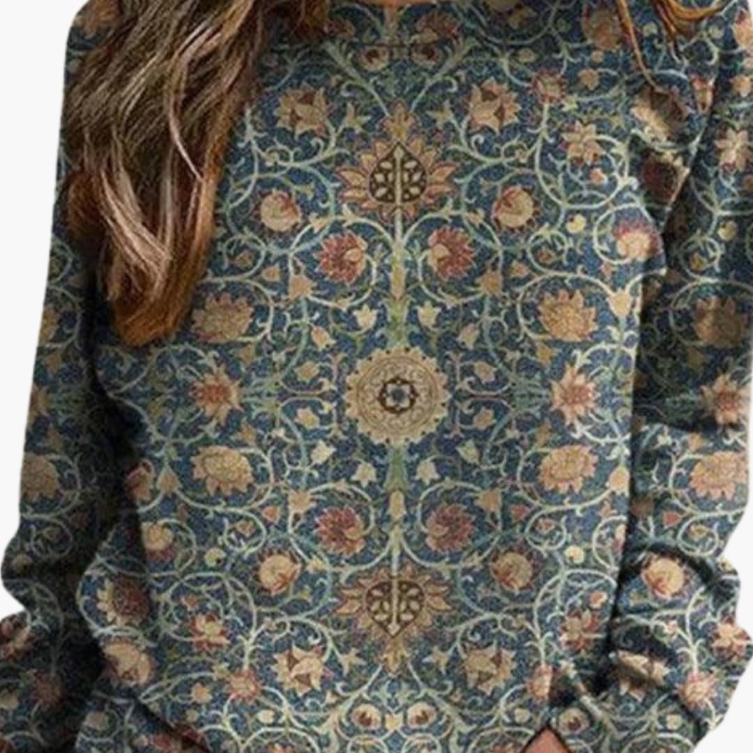 Pull femme avec motif fleuri et surface tricotée