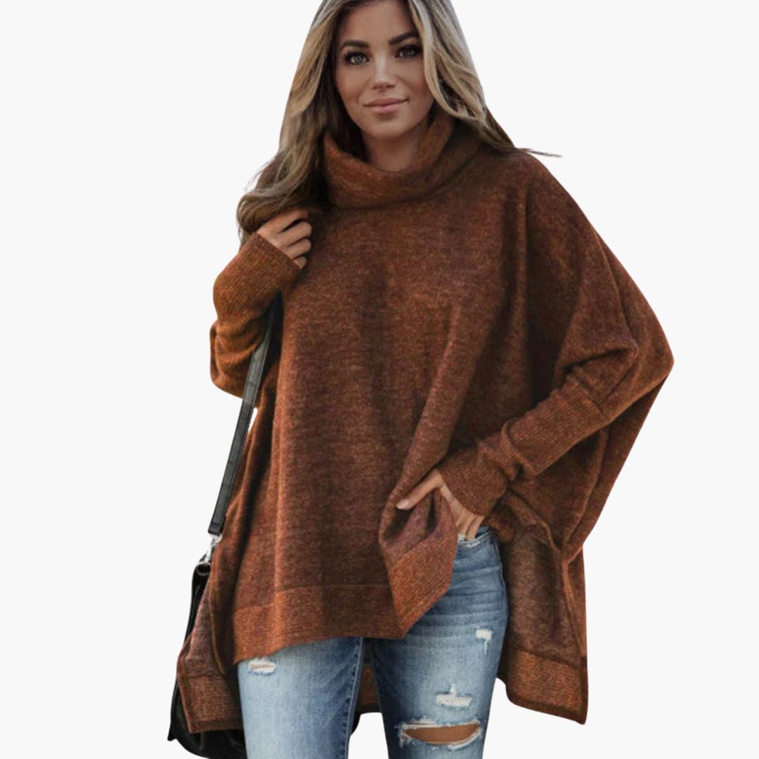 Dame poncho med bred krave og asymmetrisk kant