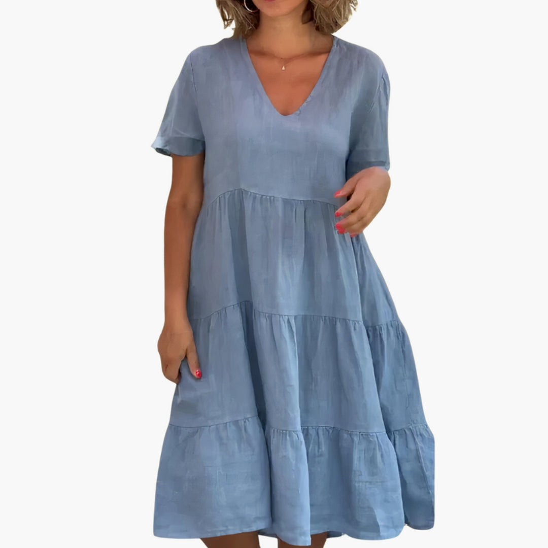 Abito donna con scollo a V, taglio ampio e gonna a balze