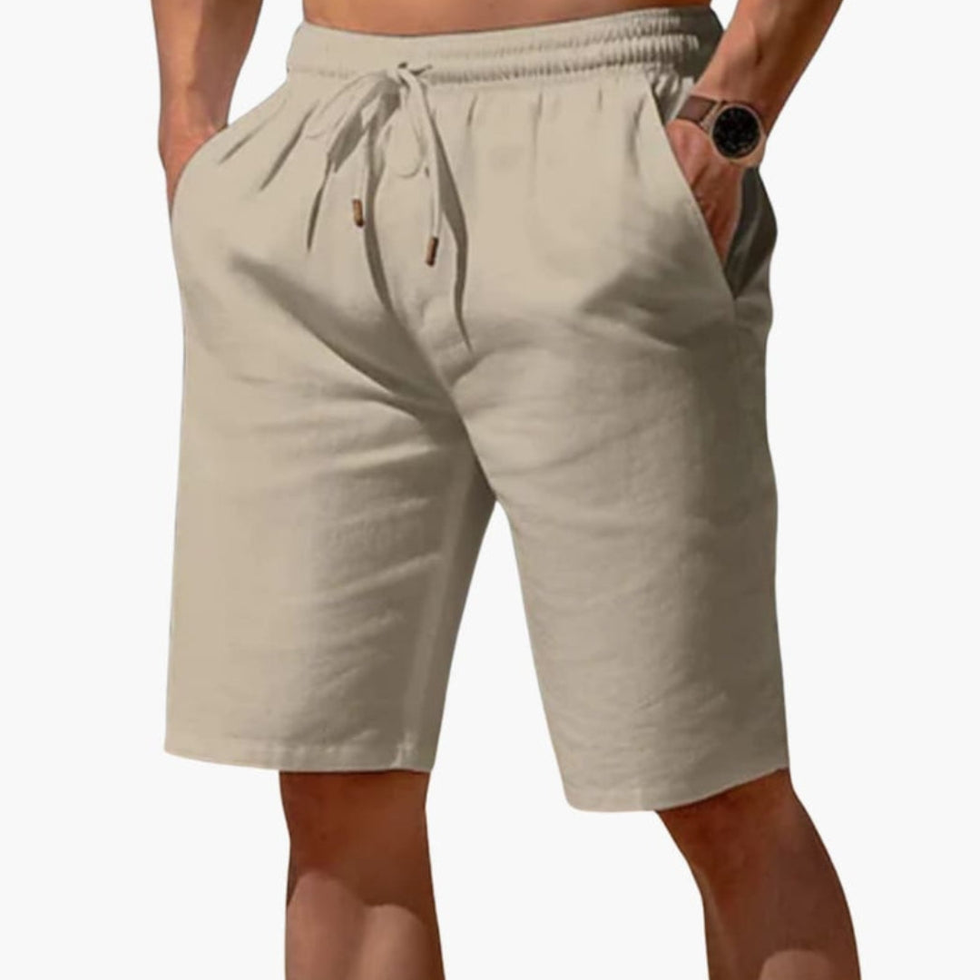 Short homme a taille à poches latérales et  surface unie