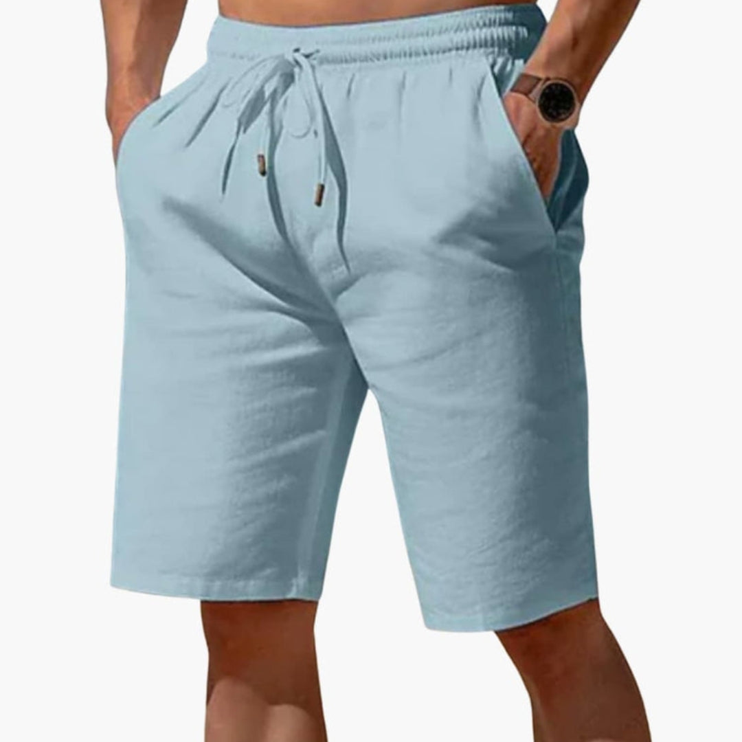 Short homme a taille à poches latérales et  surface unie