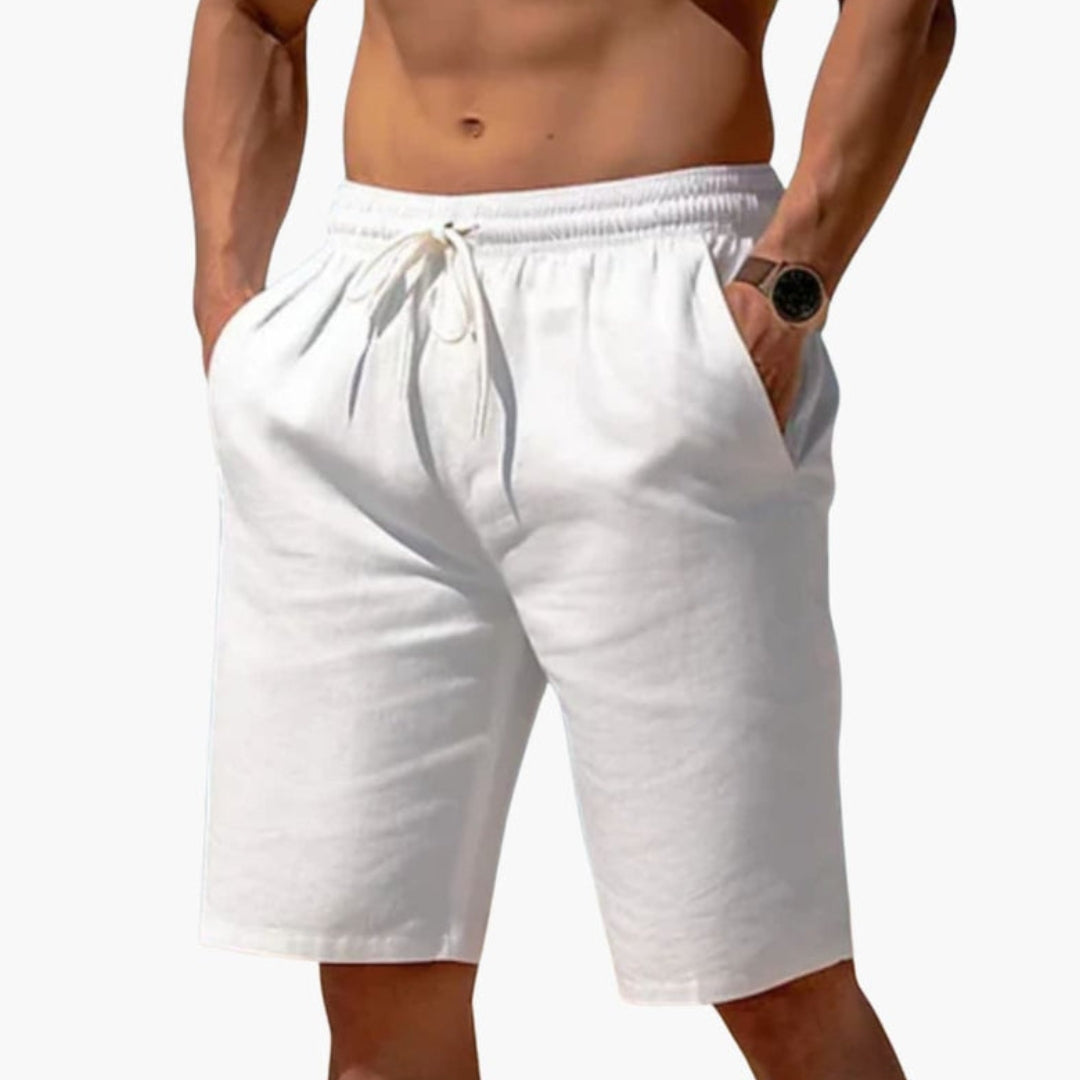 Short homme a taille à poches latérales et  surface unie